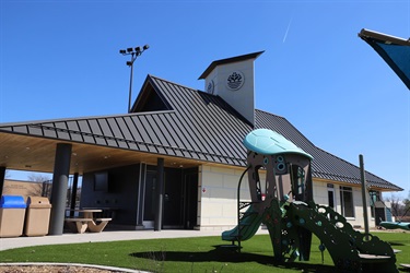Bobby Theisen building with playground